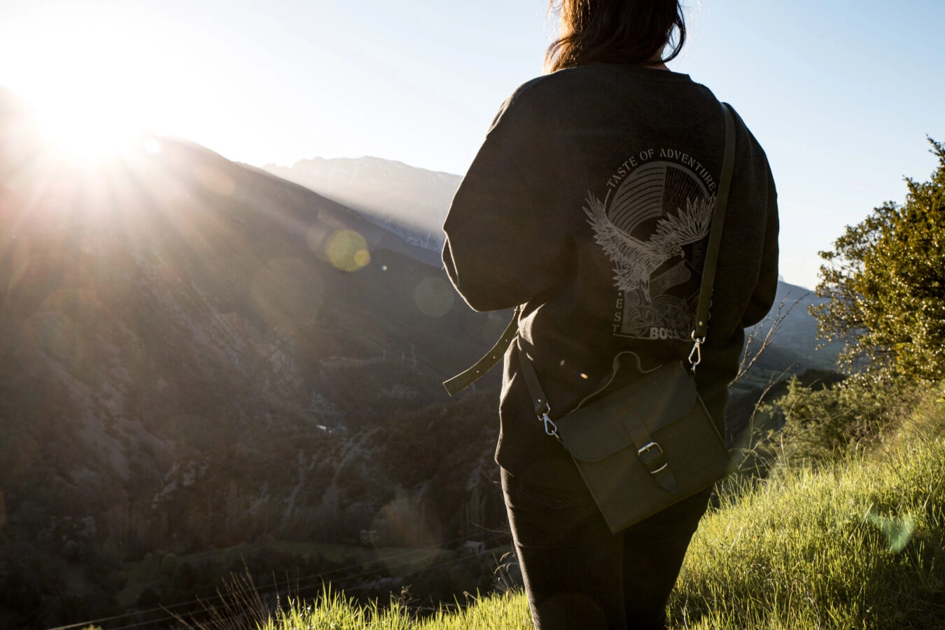 A girl looking to a mountain, wearing a bocca jacket
